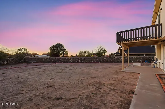 a view of a backyard with sitting area