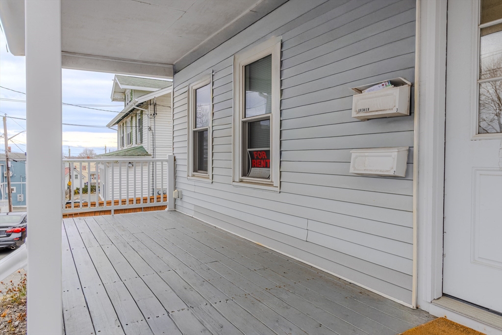34 Perkins Street, Unit 2 Gloucester, MA 01930 - Photo 17 of 19 a view of a deck with wooden floor and stairs
