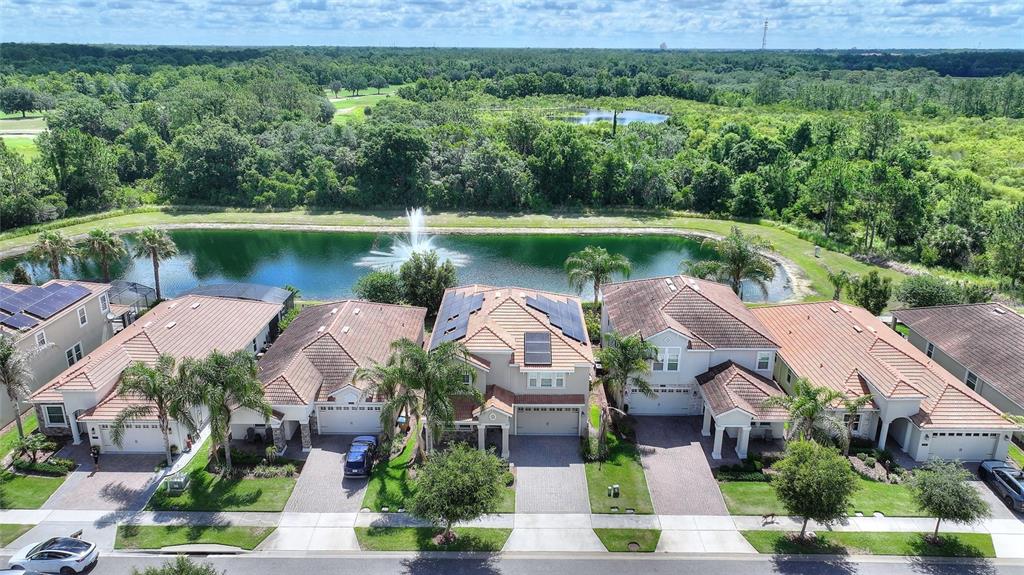 1089 Blackwolf Run Road Davenport, FL 33896 - Photo 51 of 82 an aerial view of a house with garden space and lake view