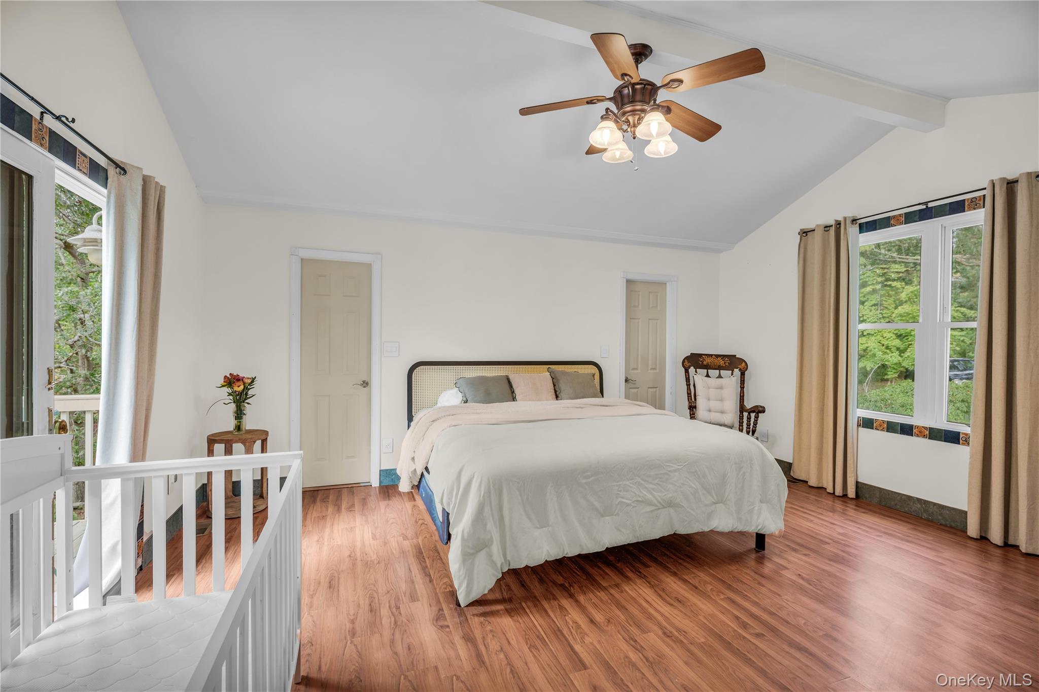 64 Sally Lane Ridge, NY 11961 - Photo 11 of 18 Bedroom featuring multiple windows, wood finished floors, and ceiling fan