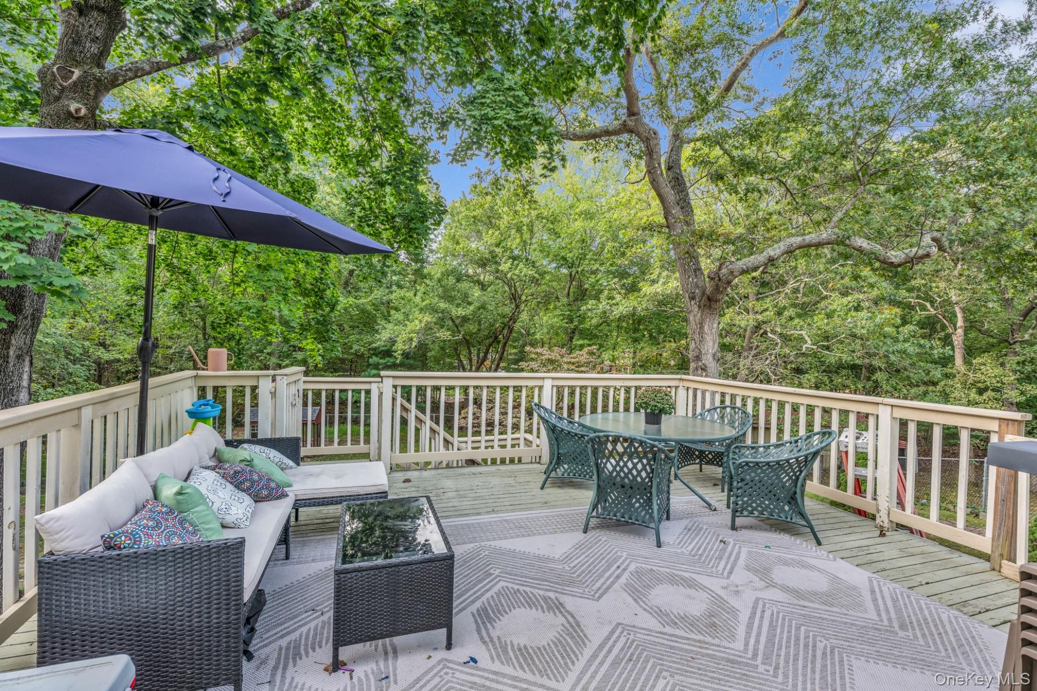 64 Sally Lane Ridge, NY 11961 - Photo 18 of 18 Deck featuring outdoor dining space and an outdoor hangout area