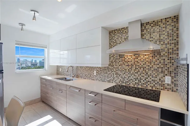 a kitchen with stainless steel appliances a microwave a stove and a refrigerator