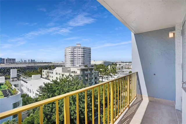 a bedroom with a bed and a view of bathroom