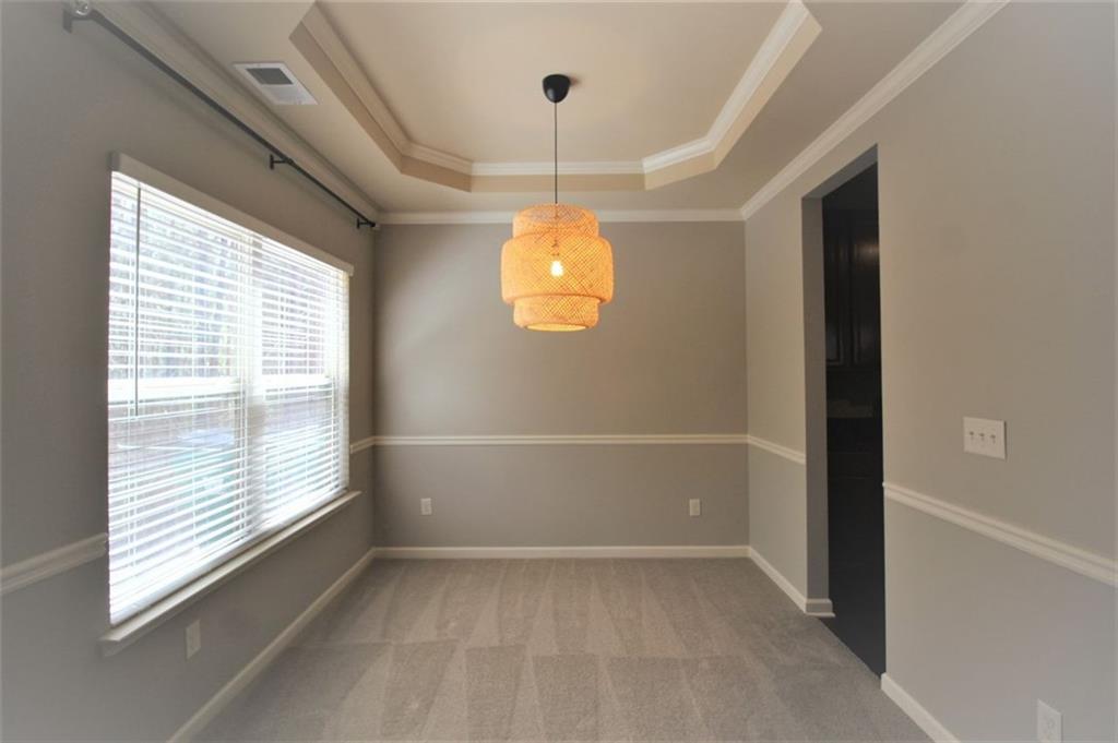 316 Alcovy Way Woodstock, GA 30188 - Photo 11 of 28 a view of an empty room with a window