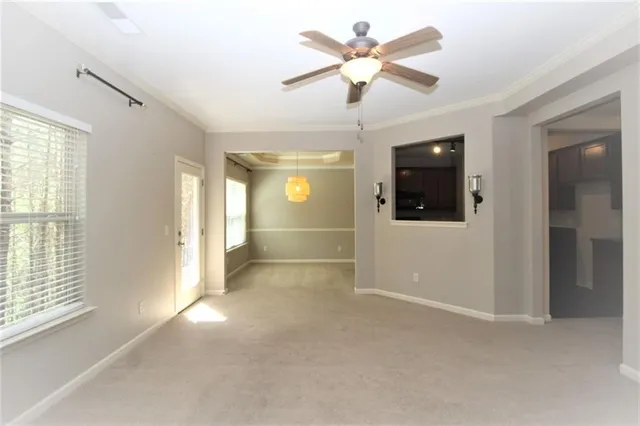 a view of staircase with railing and white walls