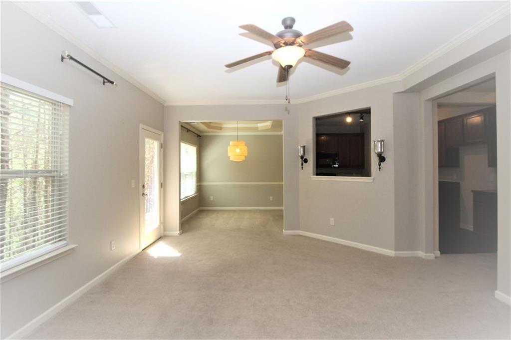 316 Alcovy Way Woodstock, GA 30188 - Photo 12 of 28 a view of a livingroom with a ceiling fan and window