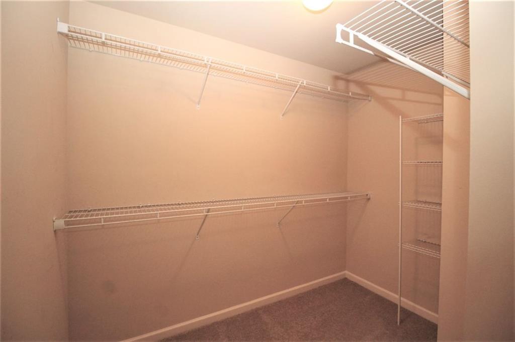 316 Alcovy Way Woodstock, GA 30188 - Photo 16 of 28 a view of a room with racks on the wall