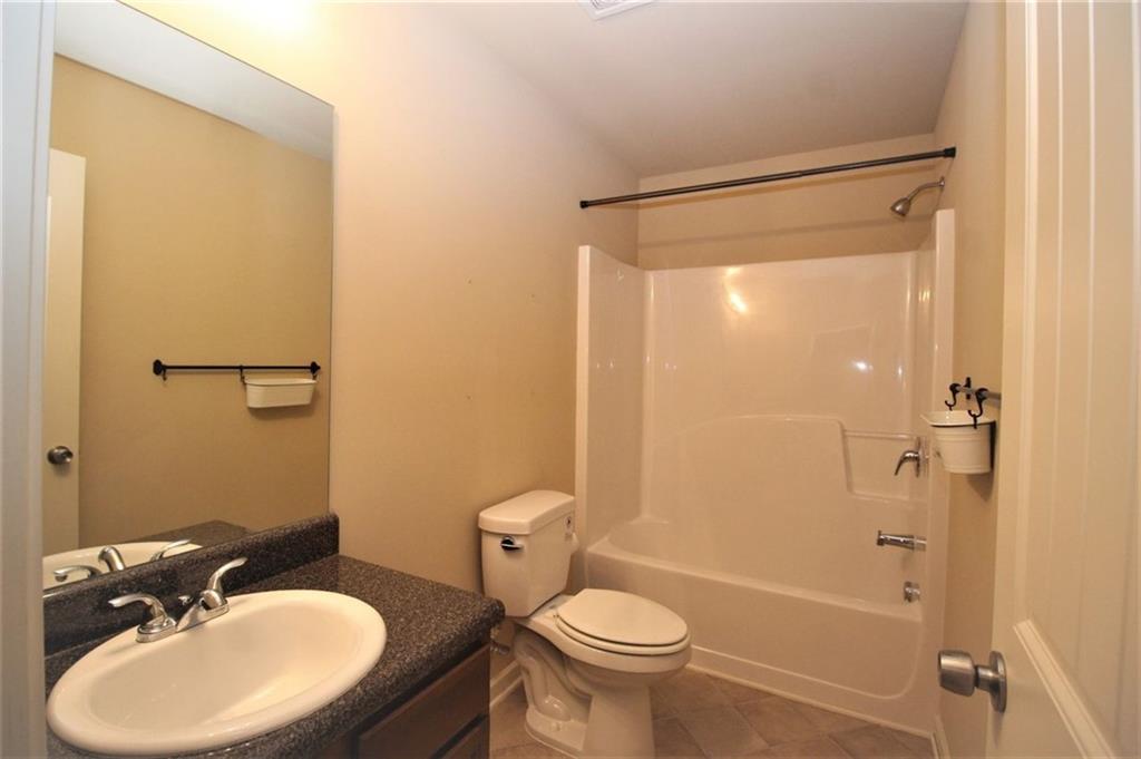 316 Alcovy Way Woodstock, GA 30188 - Photo 21 of 28 a bathroom with a sink toilet and shower