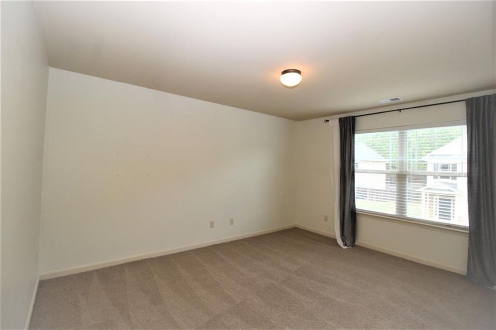 316 Alcovy Way Woodstock, GA 30188 - Photo 22 of 28 a view of an empty room with a window