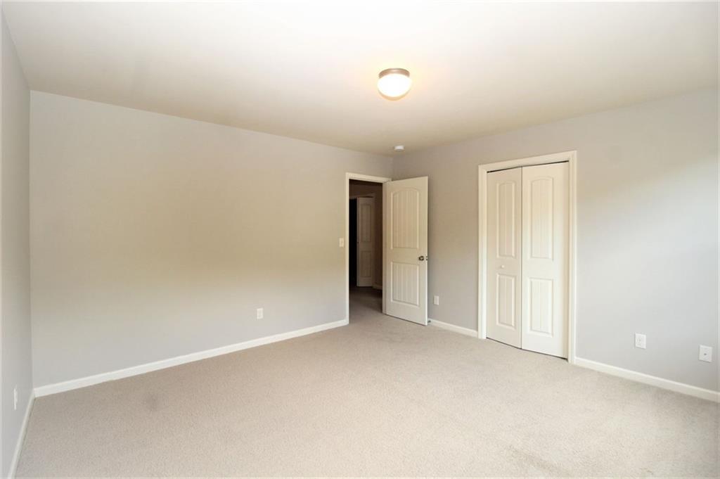 316 Alcovy Way Woodstock, GA 30188 - Photo 26 of 28 an empty room with an entryway
