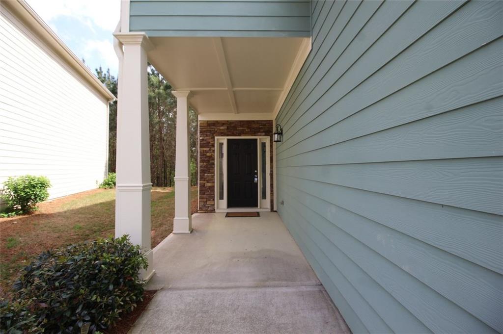 316 Alcovy Way Woodstock, GA 30188 - Photo 28 of 28 a view of a pathway to a house with backyard