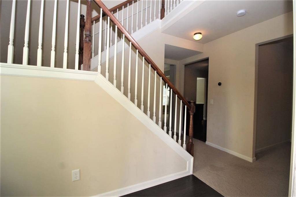 316 Alcovy Way Woodstock, GA 30188 - Photo 4 of 28 a view of a hallway with staircase