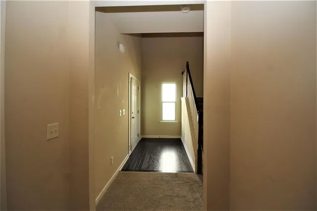 a view of staircase with wooden floor and stairs