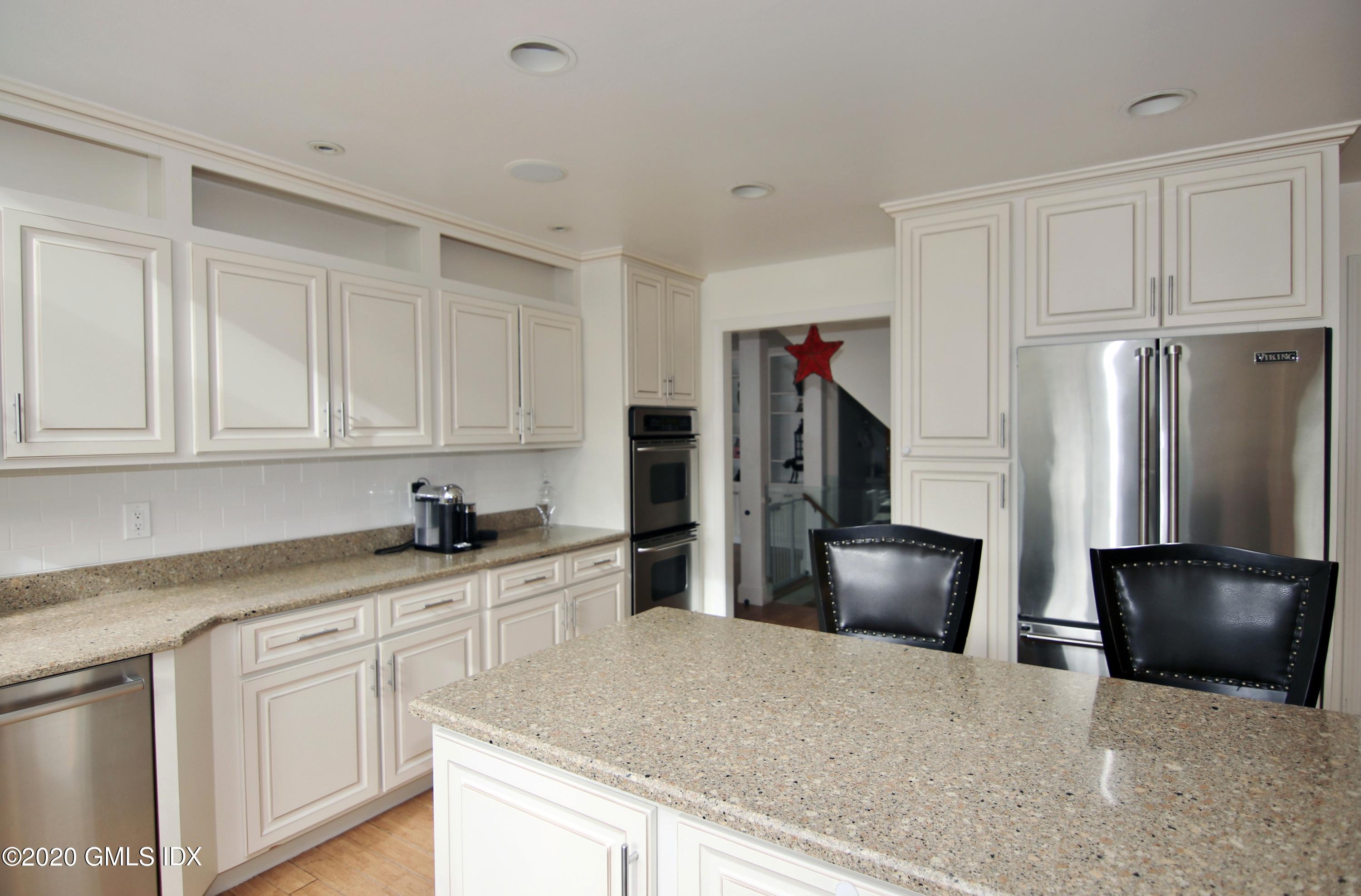 102 Gun Club Road Stamford, CT 06903 - Photo 13 of 41 a kitchen with stainless steel appliances granite countertop a refrigerator a stove a sink and a refrigerator