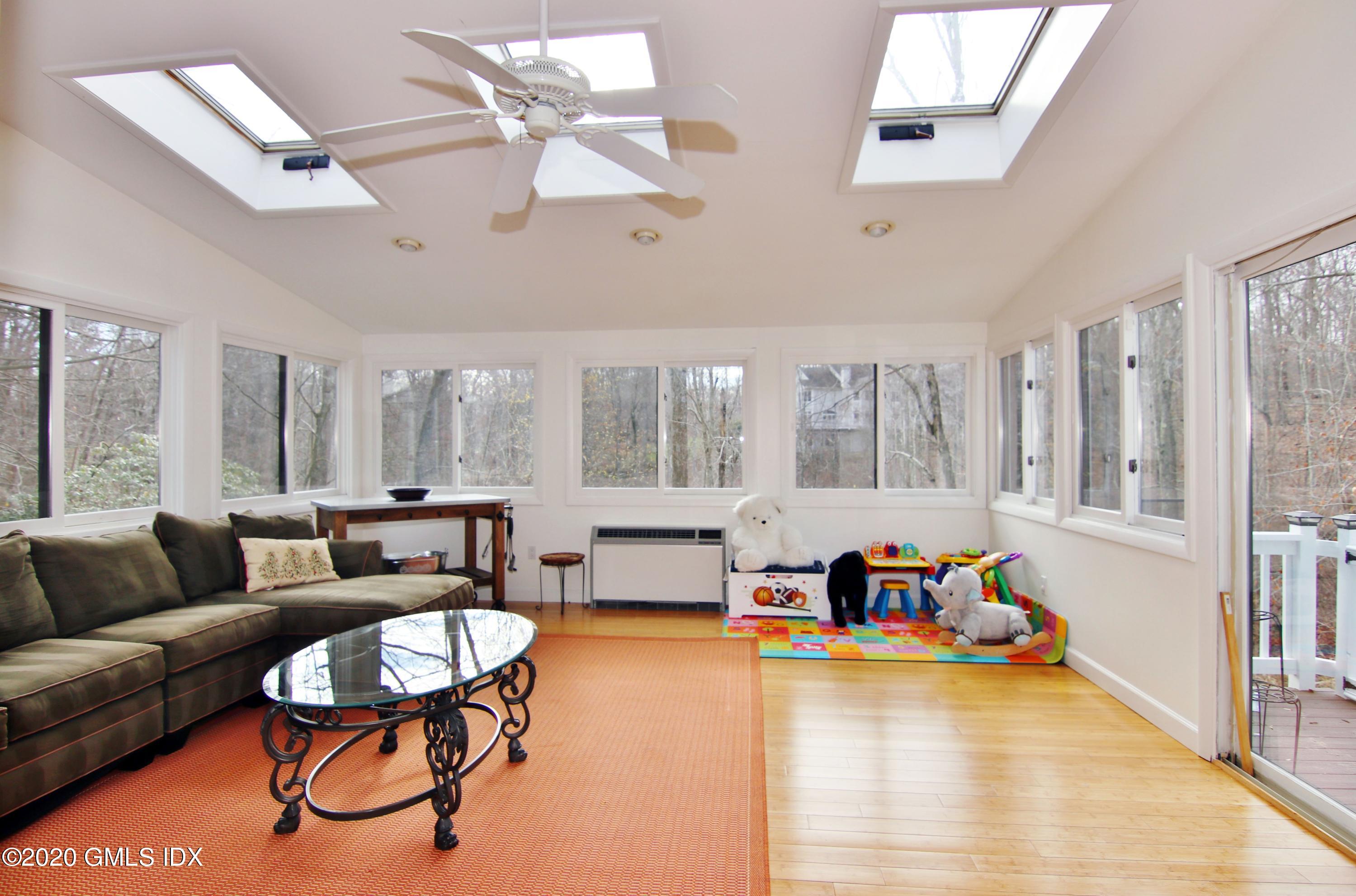 102 Gun Club Road Stamford, CT 06903 - Photo 17 of 41 a living room with furniture and a large window