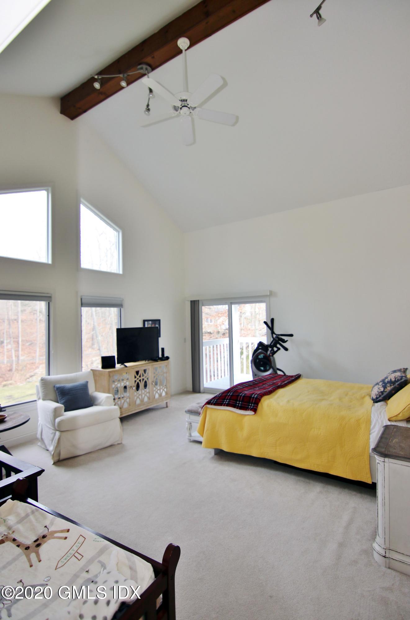 102 Gun Club Road Stamford, CT 06903 - Photo 24 of 41 a bedroom with a bed and window