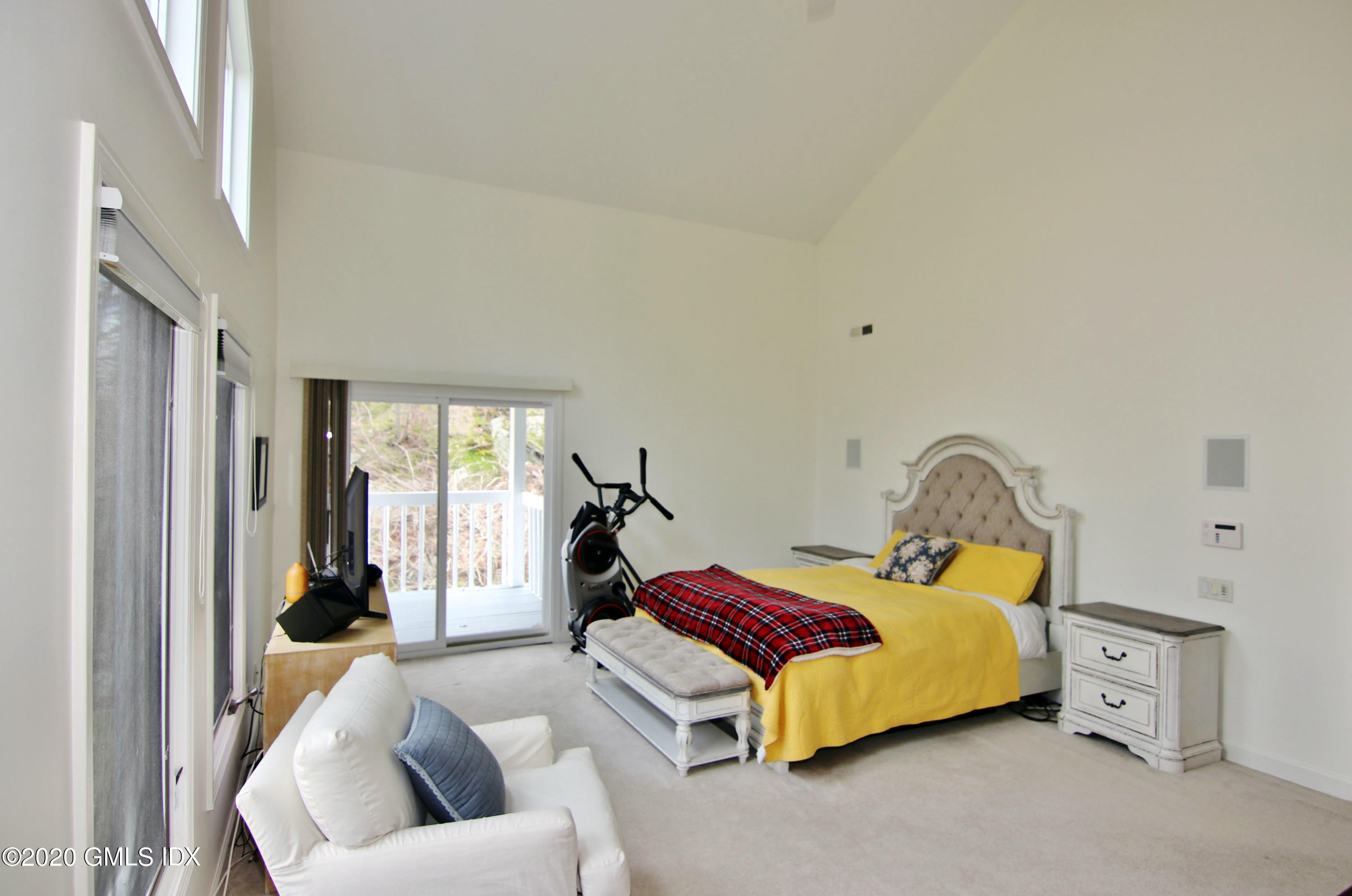 102 Gun Club Road Stamford, CT 06903 - Photo 25 of 41 a bedroom with a bed and a couch