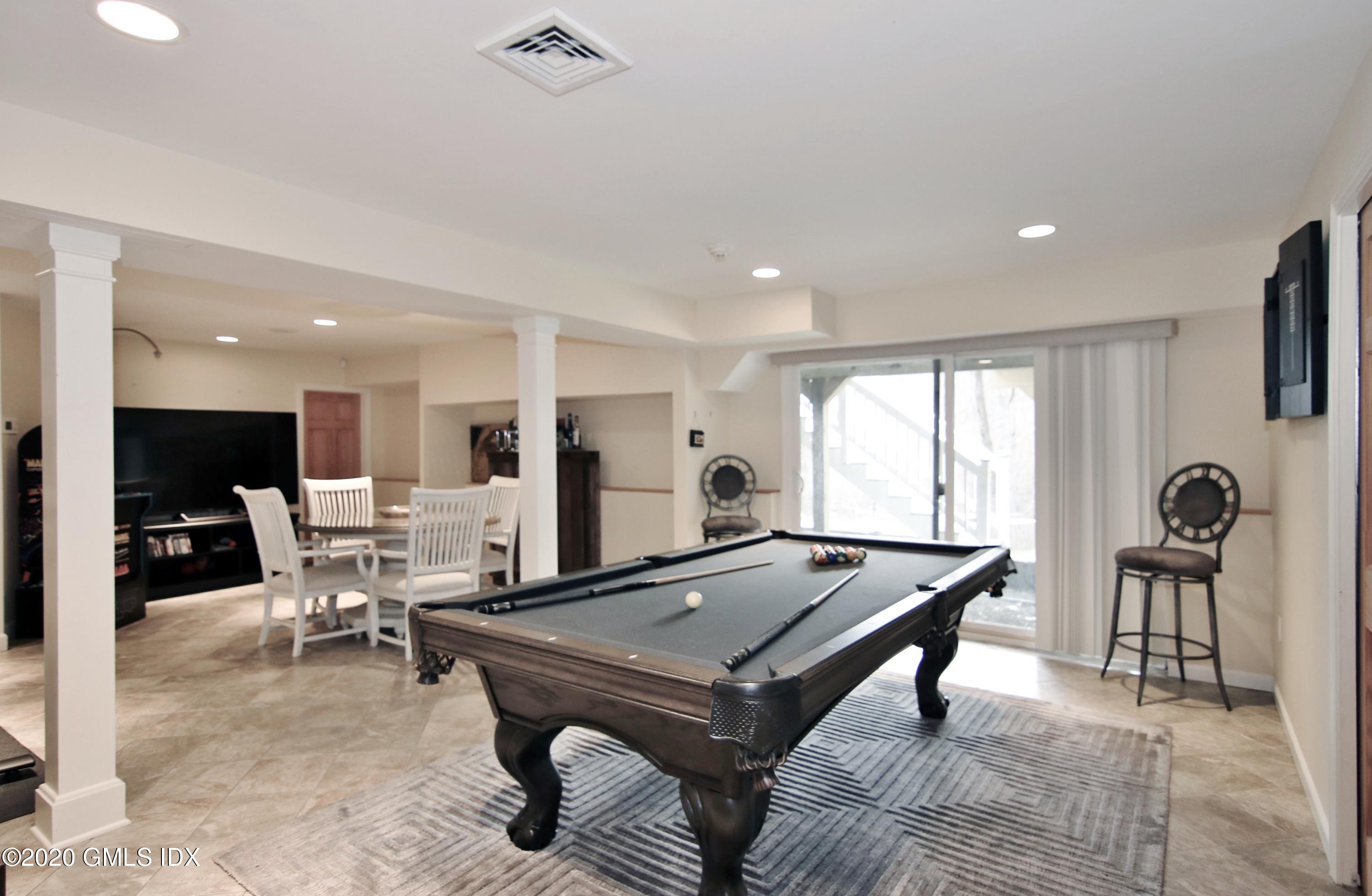 102 Gun Club Road Stamford, CT 06903 - Photo 33 of 41 a room with furniture pool table and glass windows