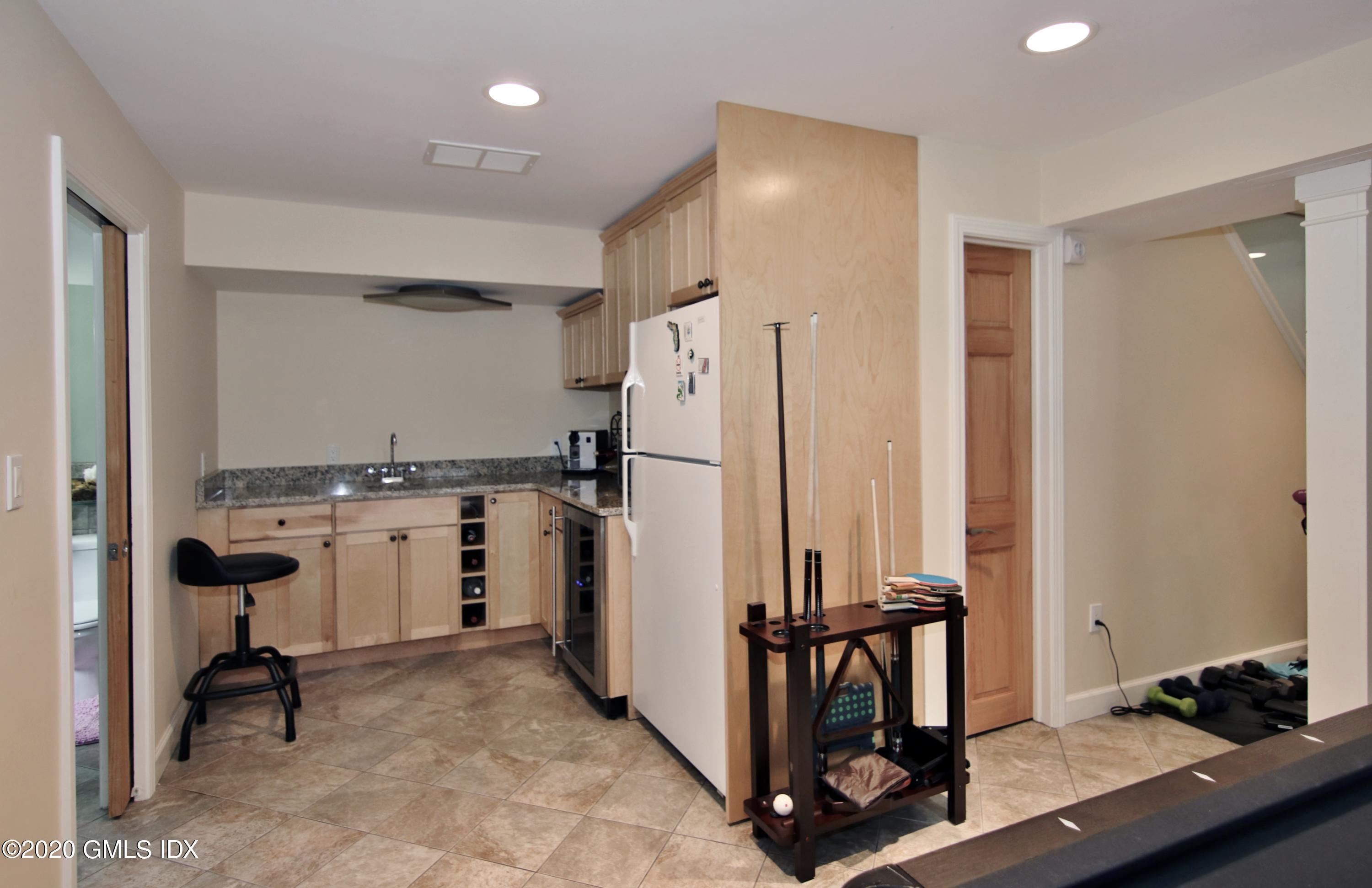 102 Gun Club Road Stamford, CT 06903 - Photo 35 of 41 a view of a refrigerator in kitchen and utility room