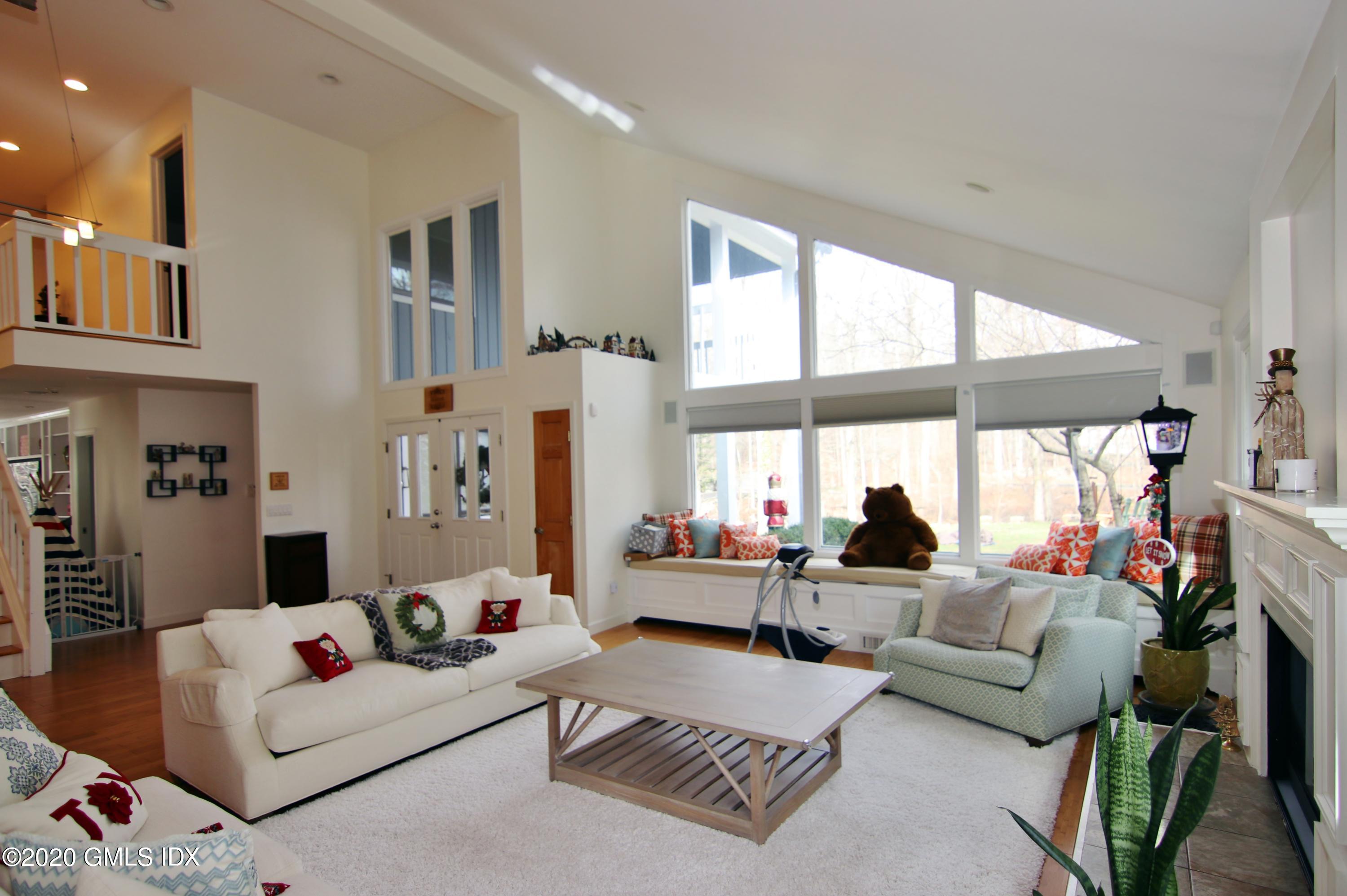 102 Gun Club Road Stamford, CT 06903 - Photo 5 of 41 a living room with furniture and a large window