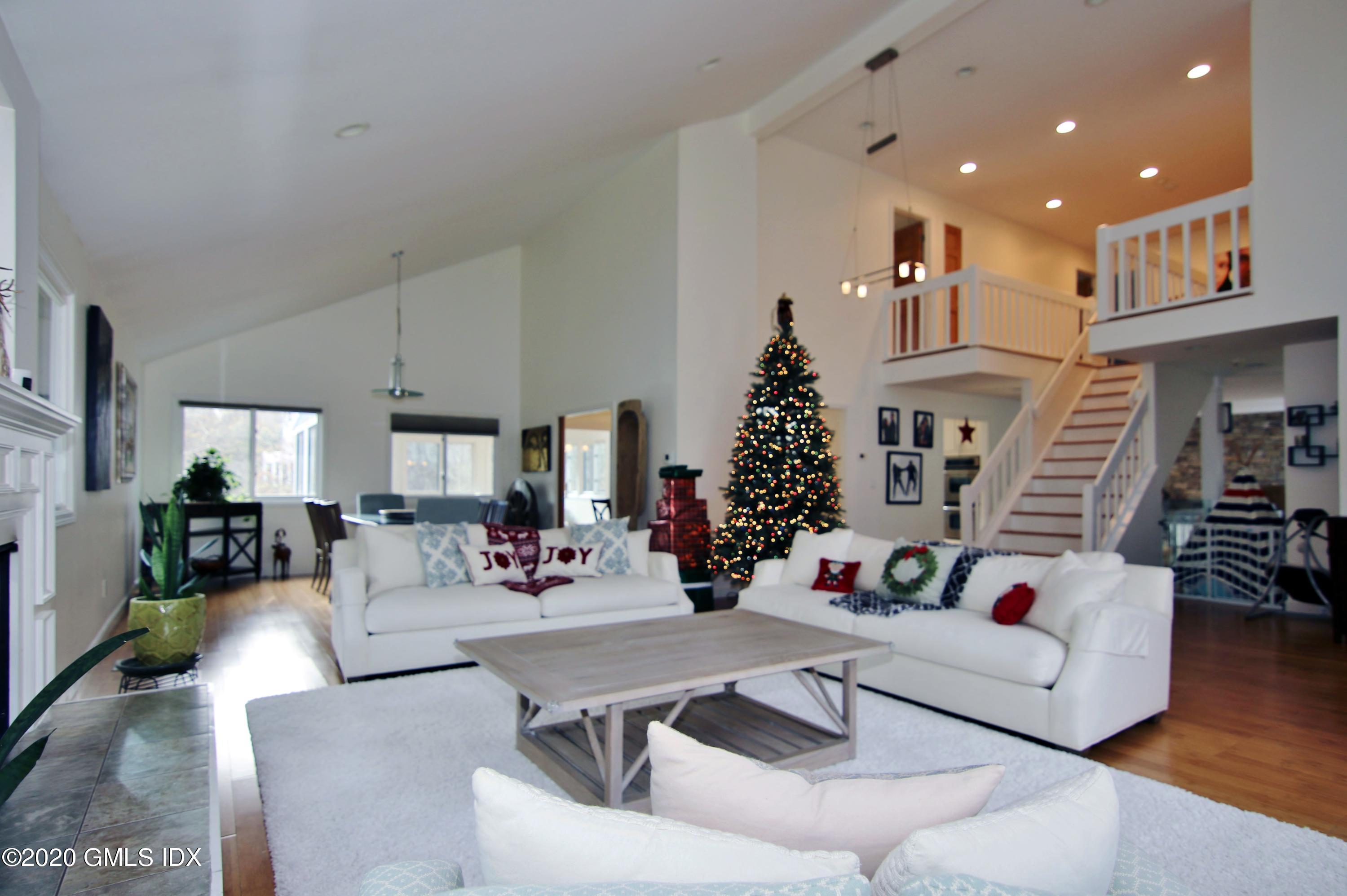 102 Gun Club Road Stamford, CT 06903 - Photo 6 of 41 a living room with furniture and a fireplace
