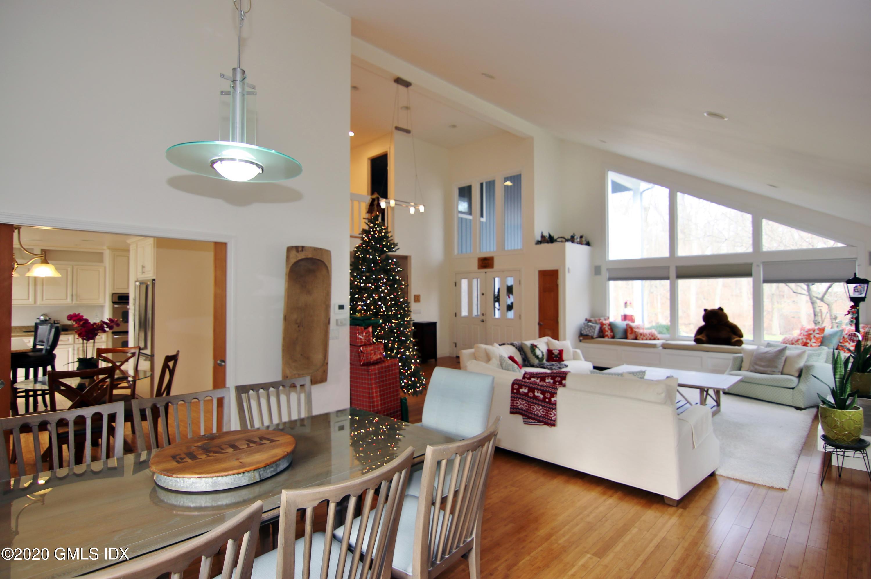 102 Gun Club Road Stamford, CT 06903 - Photo 7 of 41 a view of a dining room with furniture window and wooden floor