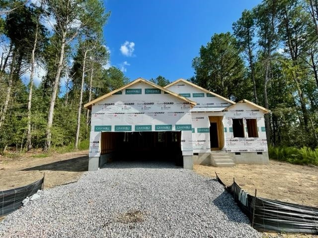 71 Deep Blue Trail Middlesex, NC 27557 - Photo 1 of 9 a front view of a house with yard and trees in the background