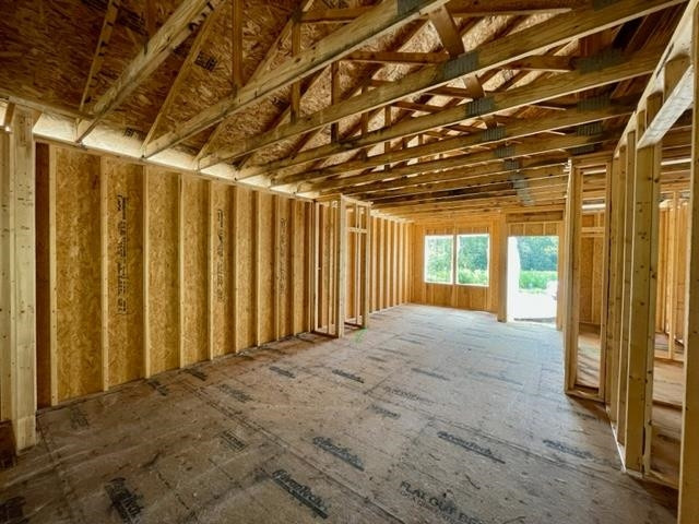 71 Deep Blue Trail Middlesex, NC 27557 - Photo 2 of 9 a view of an empty room with floor to ceiling window and stairs