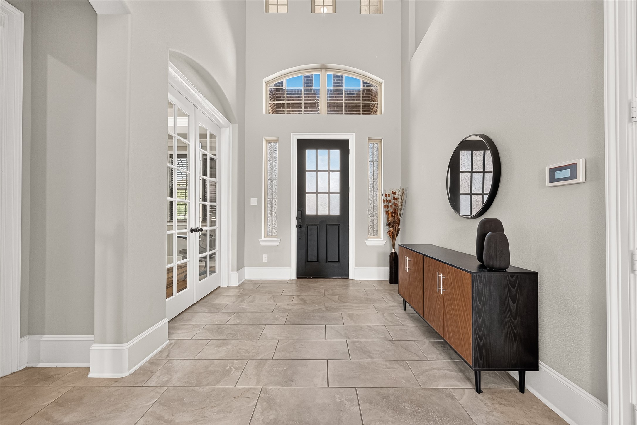 4207 Reagan Ridge Court Richmond, TX 77406 - Photo 8 of 50 Light-filled foyer with soaring ceilings and designer details.