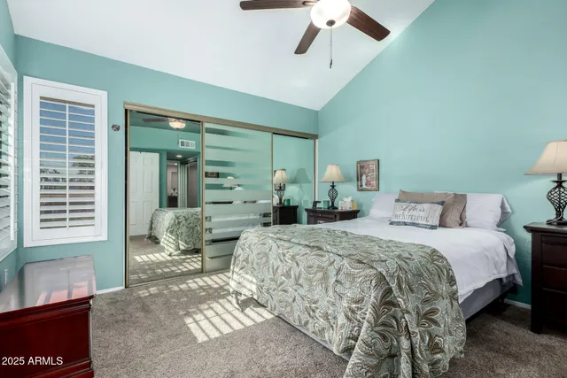 a bed room with a bed and a window