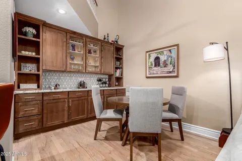 a view of a dining room that has a table and chair in it