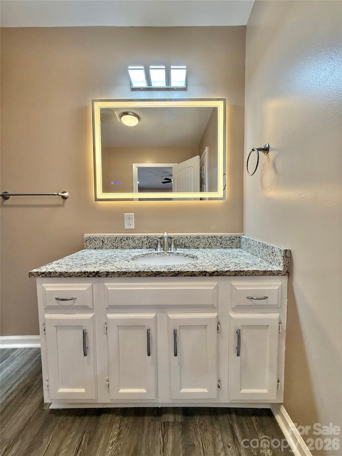 878 Stanback Ferry Road Lilesville, NC 28091 - Photo 14 of 19 a bathroom with granite countertop white vanity granite and a sink
