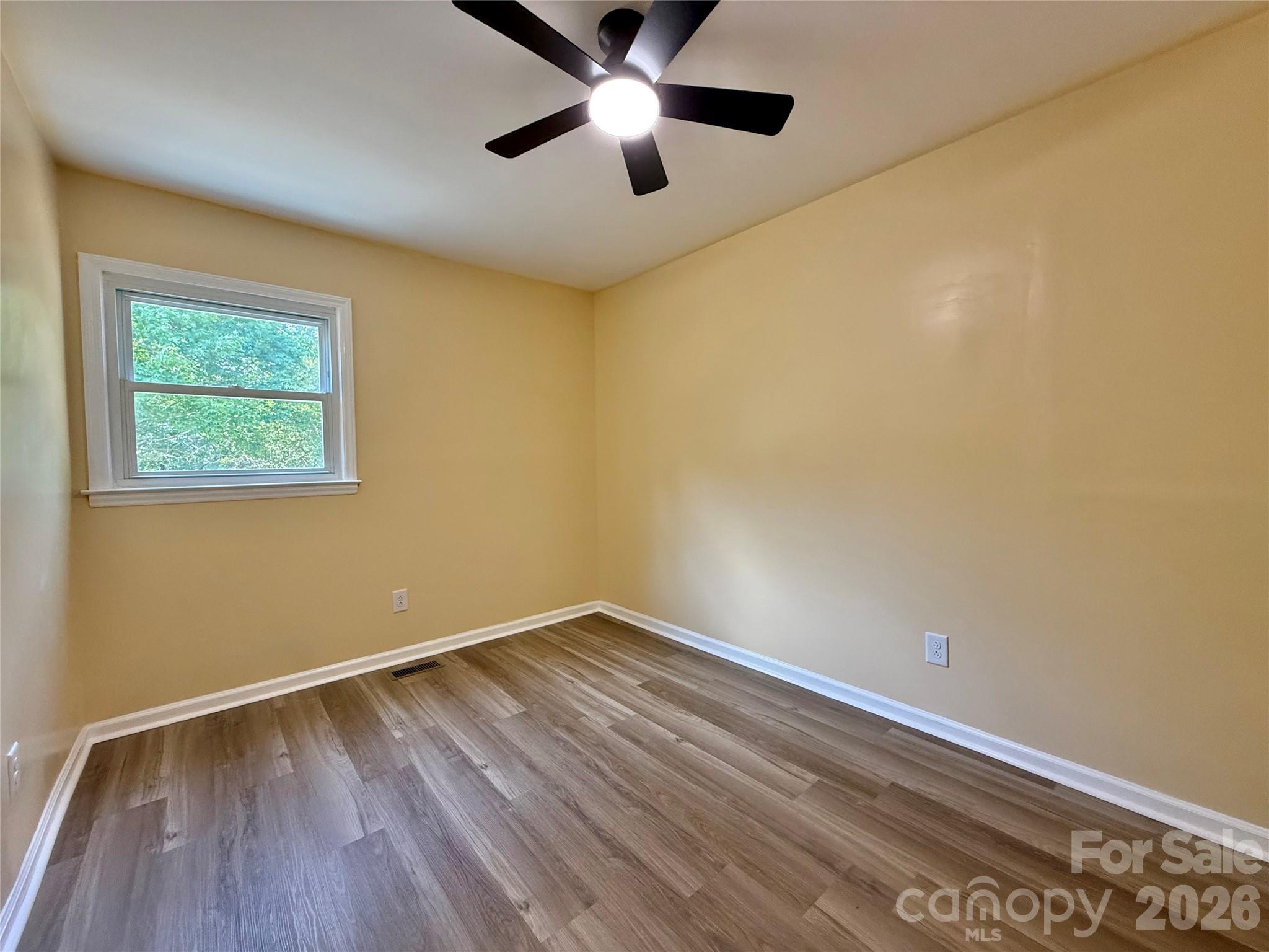 878 Stanback Ferry Road Lilesville, NC 28091 - Photo 18 of 19 a view of empty room with wooden floor