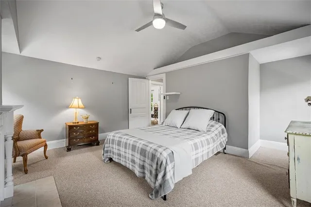 a view of a backyard with wooden fence