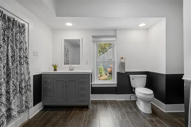 a view of a wooden house with a yard