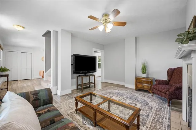 a kitchen with granite countertop a stove a sink and a refrigerator