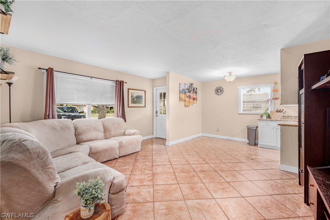 2417 Hibiscus Road Fort Myers, FL 33905 - Photo 4 of 17 a living room with furniture and a large window