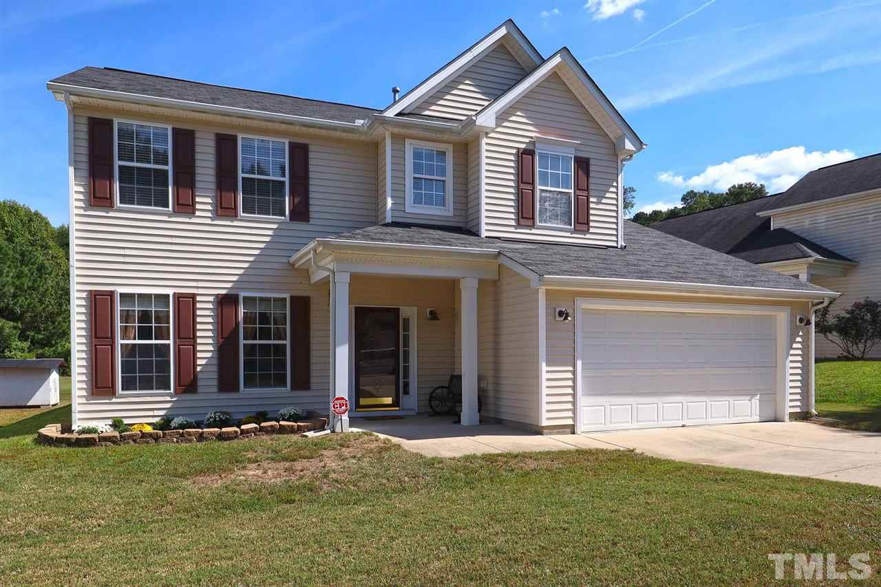 2616 Dality Drive Raleigh, NC 27604 - Photo 2 of 25 a view of a house with a yard and garage