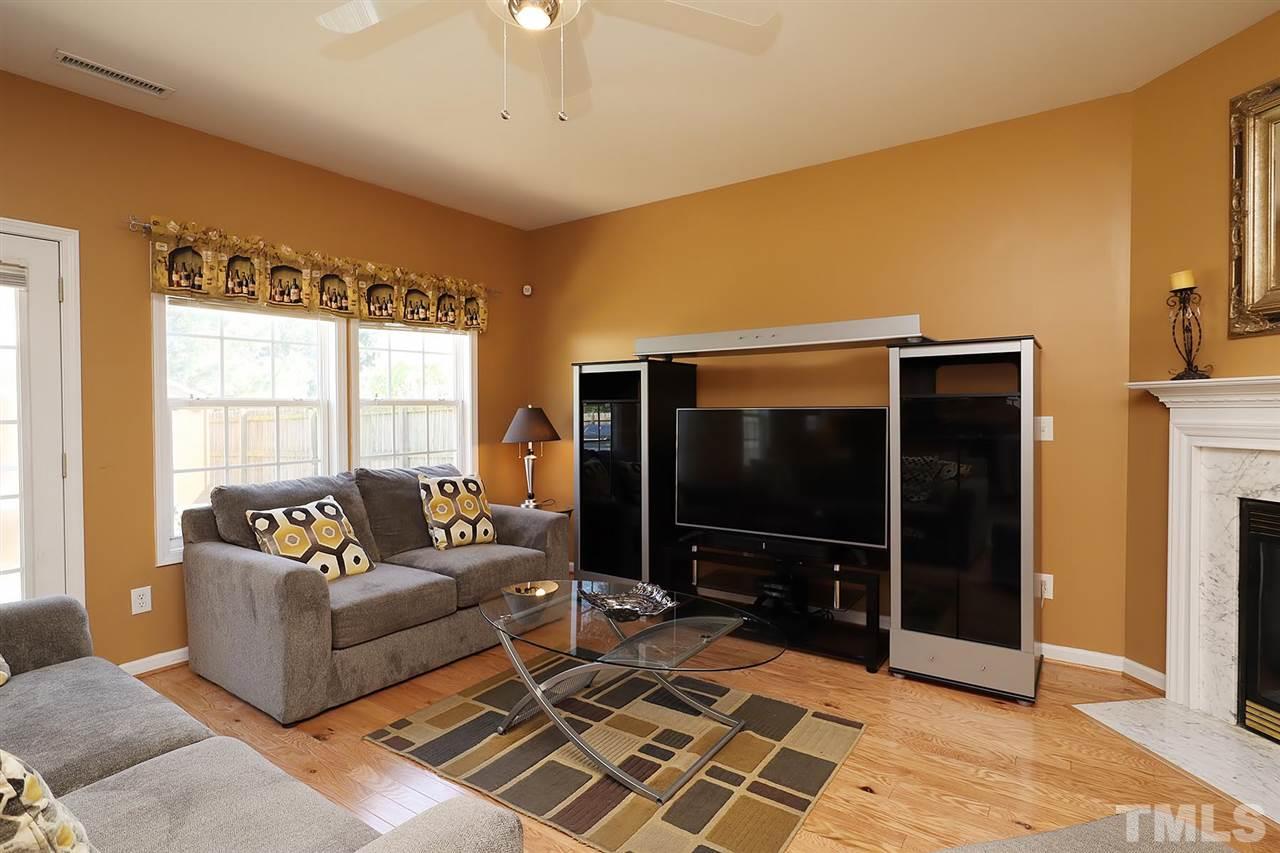 2616 Dality Drive Raleigh, NC 27604 - Photo 15 of 25 a living room with furniture and a flat screen tv