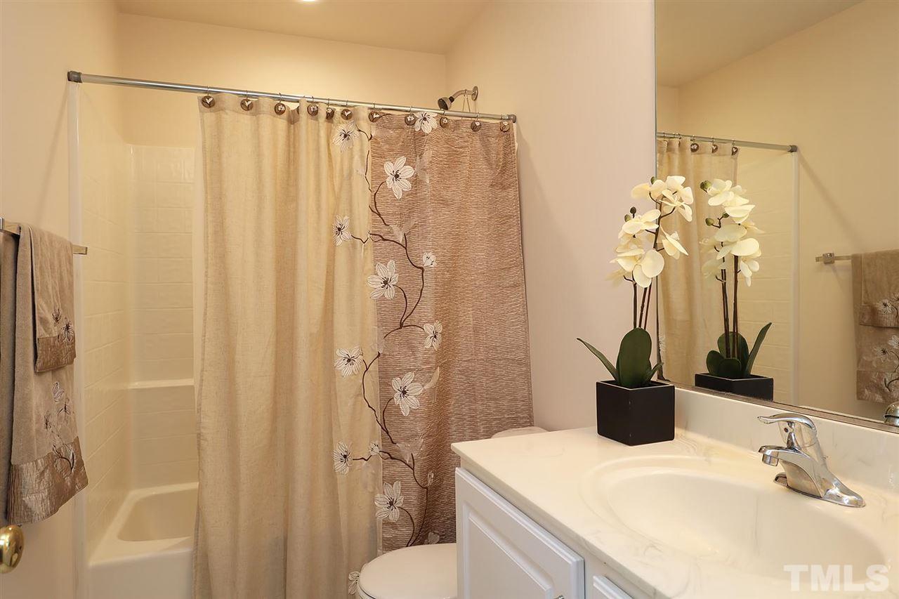 2616 Dality Drive Raleigh, NC 27604 - Photo 17 of 25 a bathroom with a sink a toilet and shower