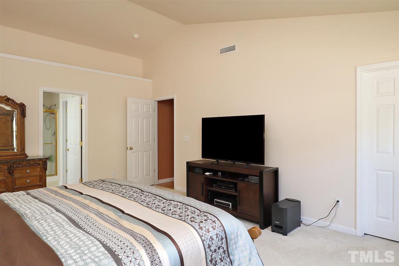 2616 Dality Drive Raleigh, NC 27604 - Photo 20 of 25 a bedroom with a bed and a flat screen tv