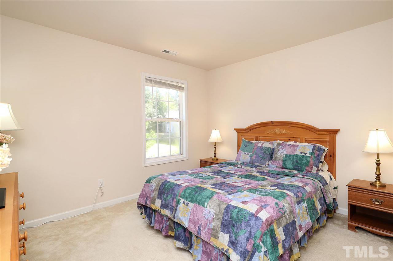 2616 Dality Drive Raleigh, NC 27604 - Photo 23 of 25 a bedroom with a bed and a window
