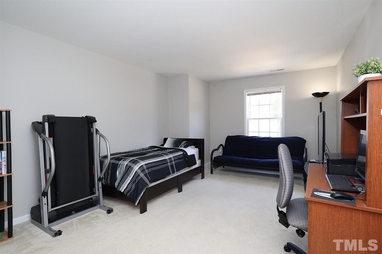 2616 Dality Drive Raleigh, NC 27604 - Photo 24 of 25 a bedroom with furniture and a window