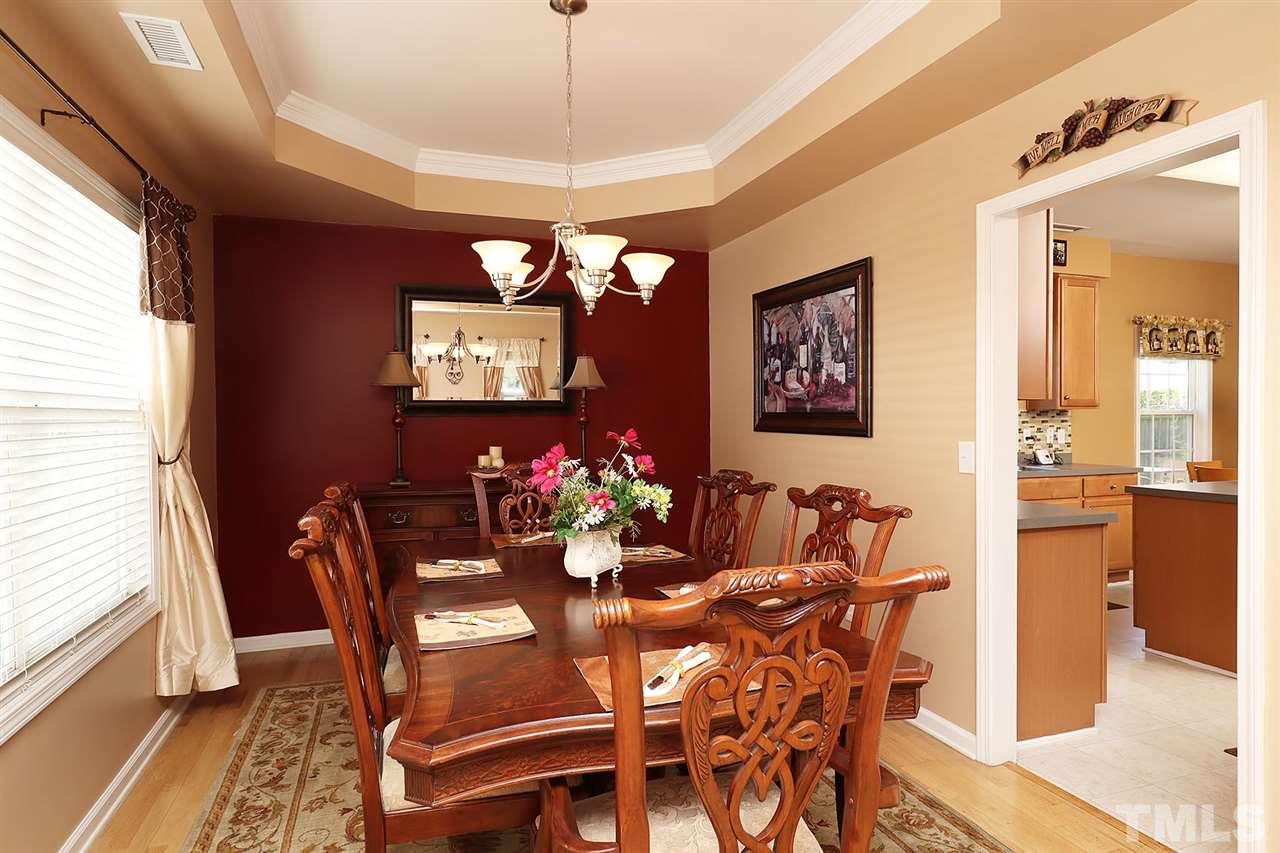 2616 Dality Drive Raleigh, NC 27604 - Photo 9 of 25 a view of a dining room with furniture window and wooden floor