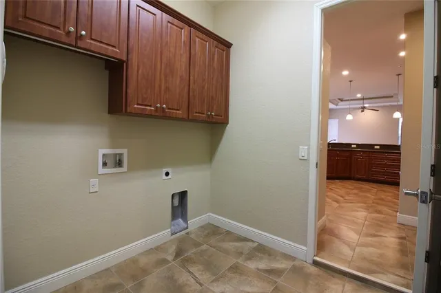 a view of kitchen and wooden cabinet