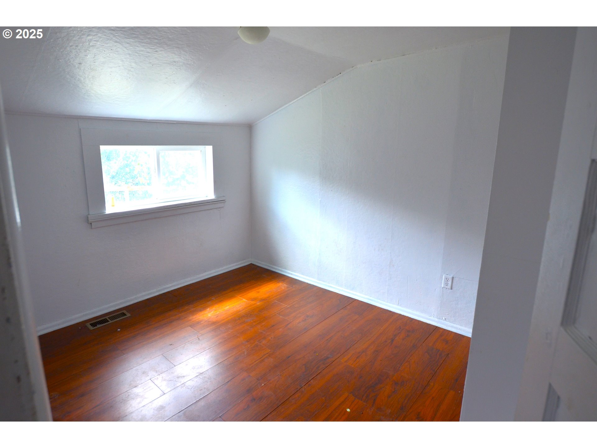 520 Northeast 4th Street Pilot Rock, OR 97868 - Photo 11 of 28 a view of empty room with wooden floor