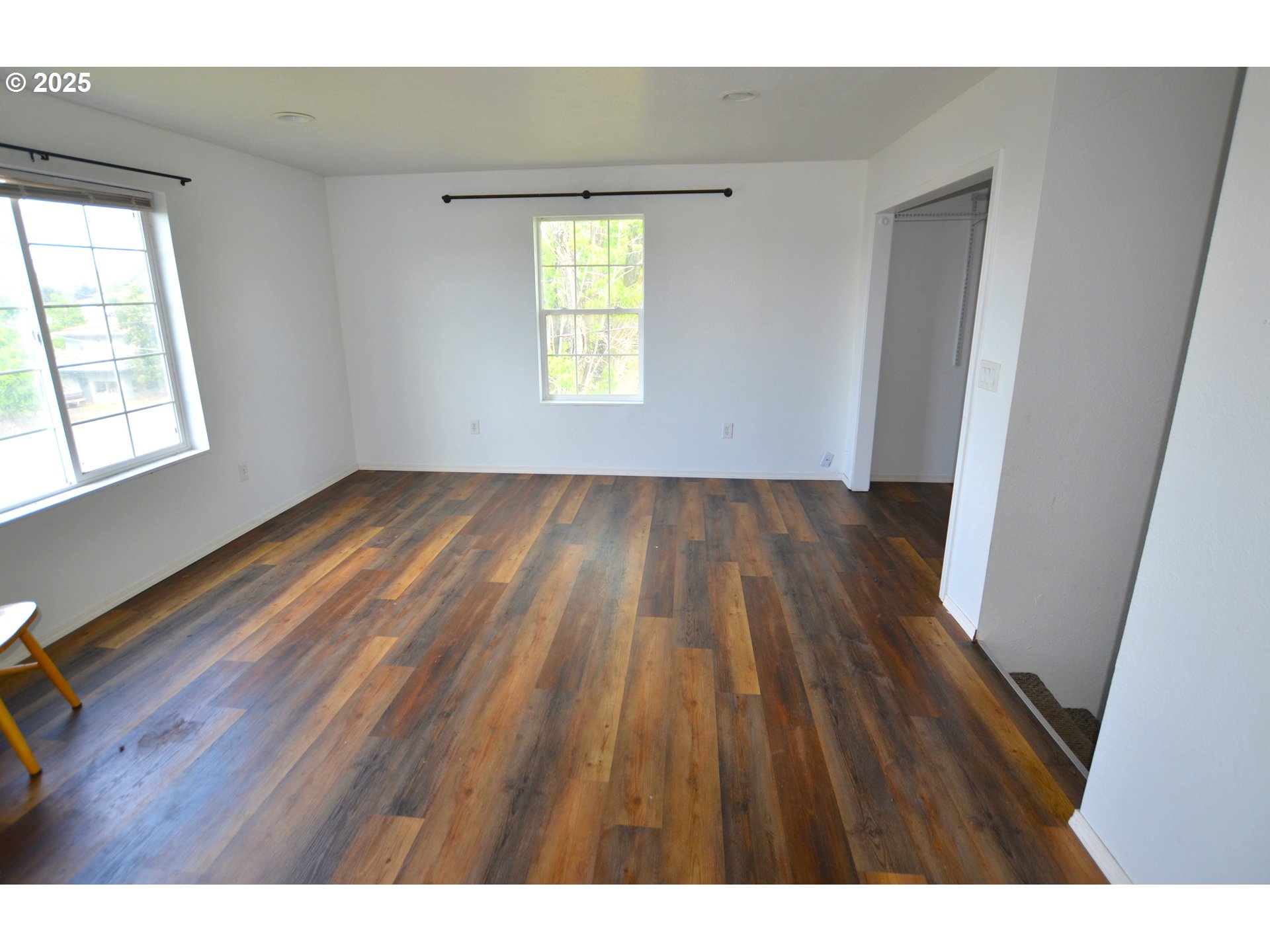 520 Northeast 4th Street Pilot Rock, OR 97868 - Photo 27 of 28 a view of an empty room with wooden floor and a window
