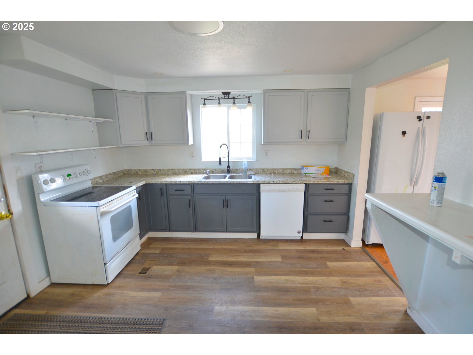 520 Northeast 4th Street Pilot Rock, OR 97868 - Photo 28 of 28 a kitchen with a sink a window and cabinets