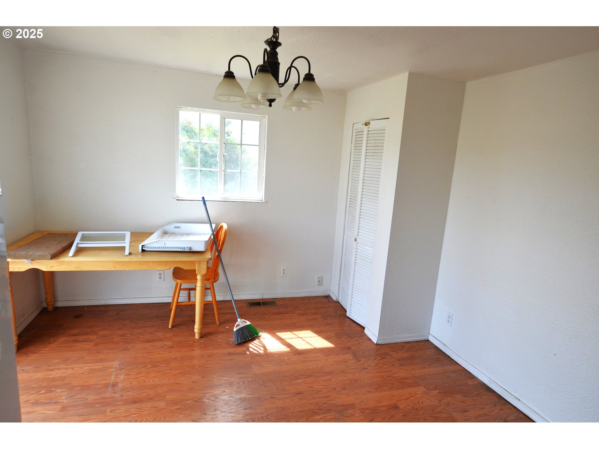520 Northeast 4th Street Pilot Rock, OR 97868 - Photo 5 of 28 a view of a room with a window and wooden floor
