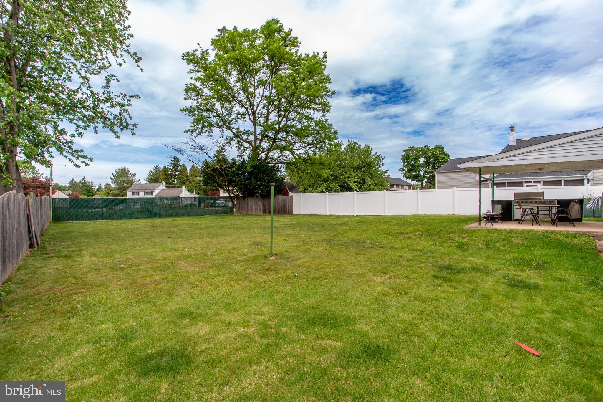 1264 Tulip Road Warminster, PA 18974 - Photo 19 of 21 a view of yard with swimming pool and green space